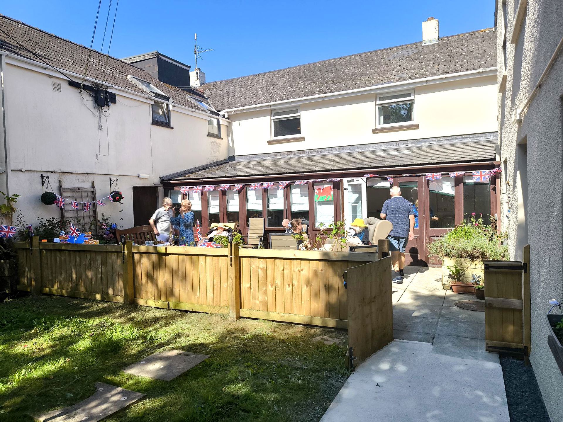 Nurses and carers with residents in the gardens at Rickeston Mill