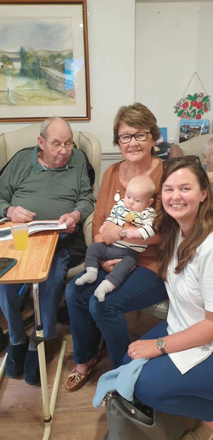 A resident sharing a happy moment with family at Rickeston Mill