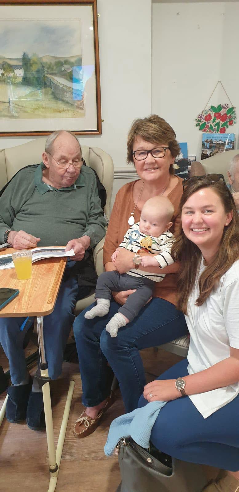 A resident sharing a happy moment with family at Rickeston Mill