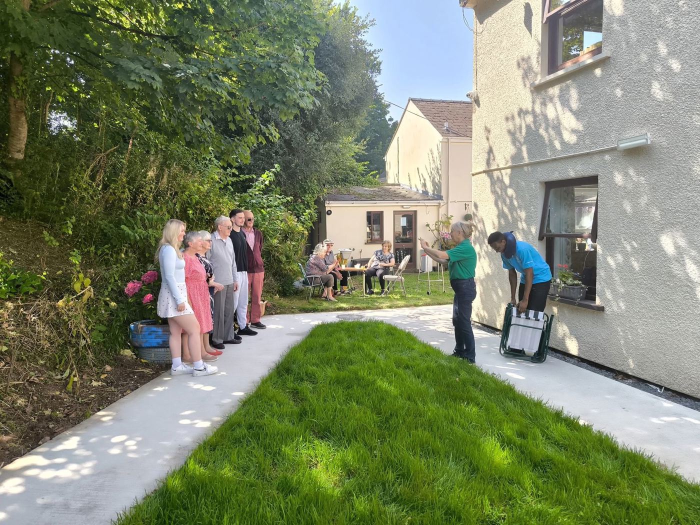A resident and family celebrating together at Rickeston Mill